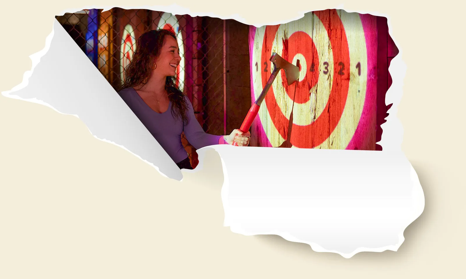 Two women throwing axes at a digital balloon pop game